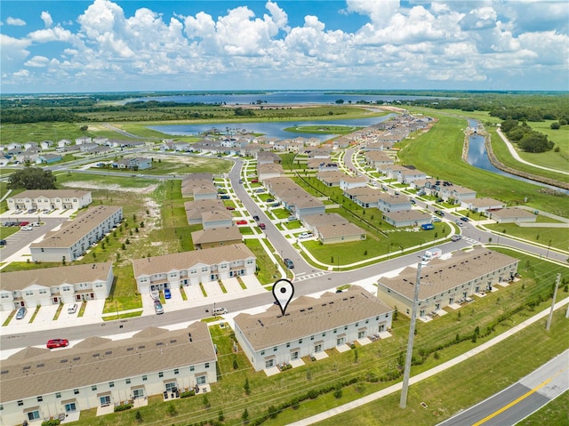 birds eye view of property featuring a water view