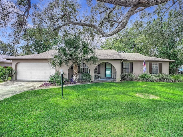 ranch-style home featuring a garage and a front yard