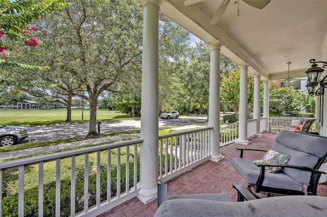 view of patio / terrace with ceiling fan and a porch