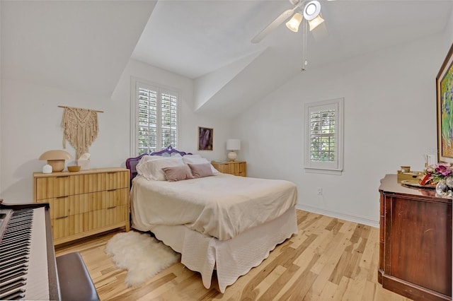 bedroom with lofted ceiling, ceiling fan, and light wood-type flooring