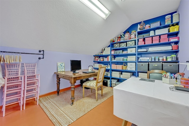 office space featuring vaulted ceiling and a textured ceiling