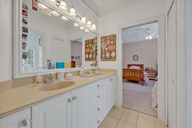 bathroom with tile patterned flooring, vanity, ornamental molding, and ceiling fan