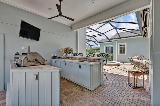 view of patio / terrace with an outdoor kitchen and an outdoor wet bar