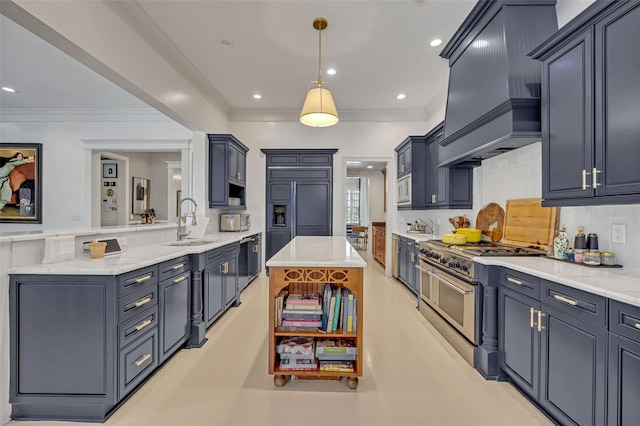 kitchen with sink, built in appliances, decorative light fixtures, custom range hood, and decorative backsplash