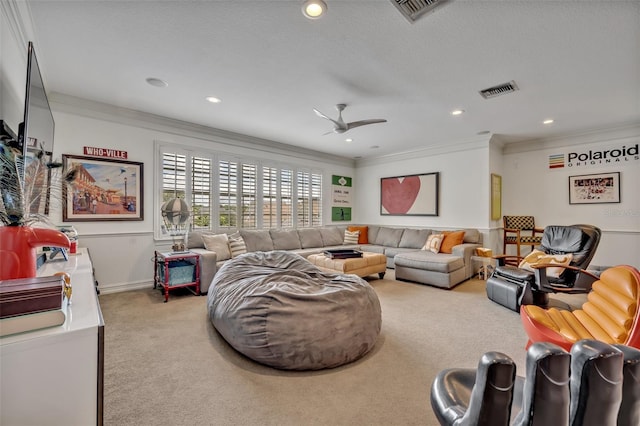 carpeted living room with crown molding, a textured ceiling, and ceiling fan