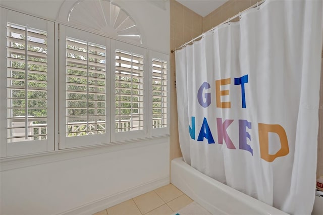 bathroom featuring tile patterned flooring and shower / tub combo