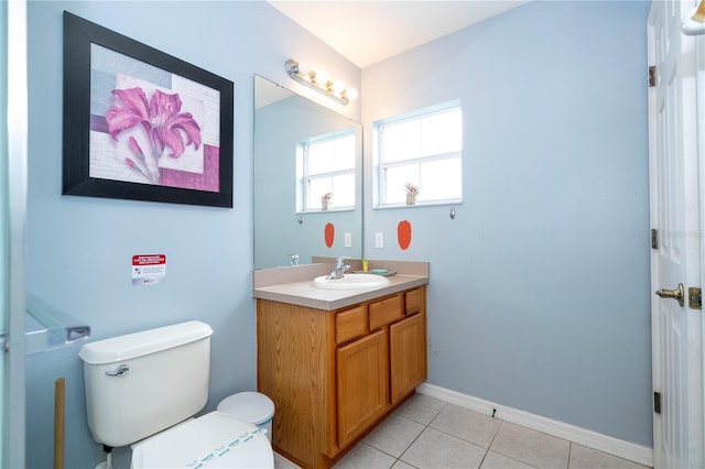 bathroom with vanity, toilet, and tile patterned flooring