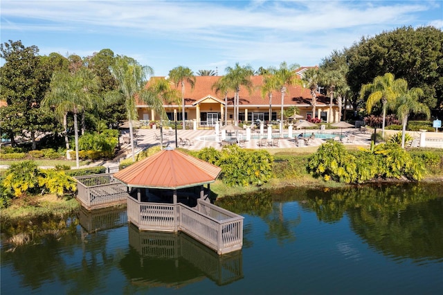 dock area featuring a patio and a water view