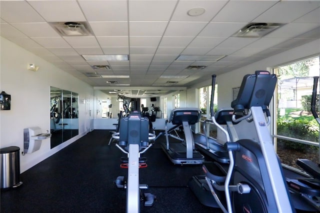 workout area with a paneled ceiling