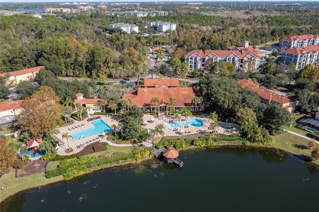 birds eye view of property with a water view