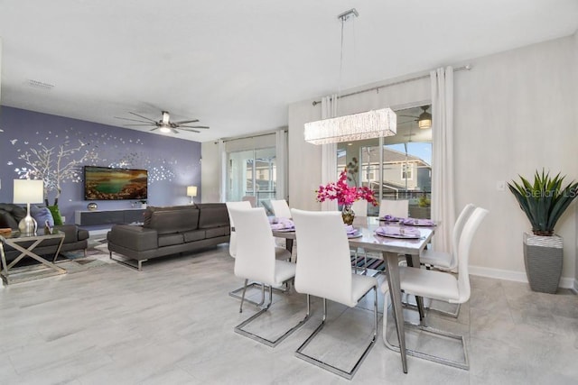 1585 Mulligan Blvd, Davenport, FL 33896 - dining room featuring an accent wall, ceiling fan, and wallpapered walls