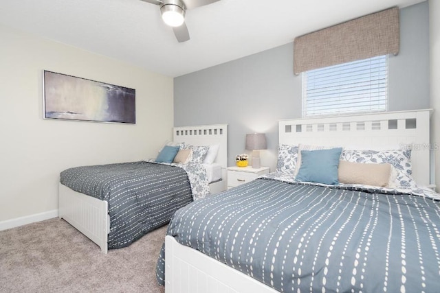 bedroom with light colored carpet and ceiling fan