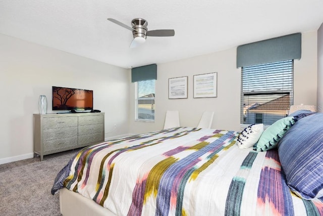 bedroom with light carpet and ceiling fan