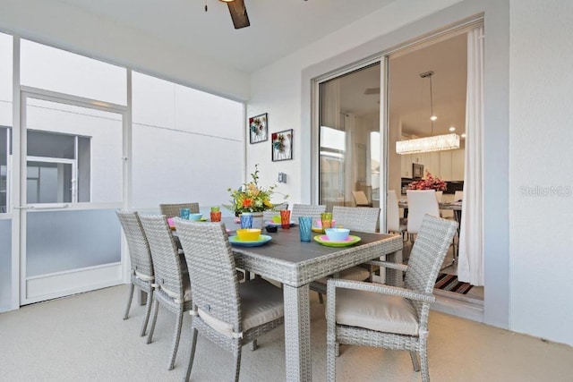 carpeted dining space featuring ceiling fan