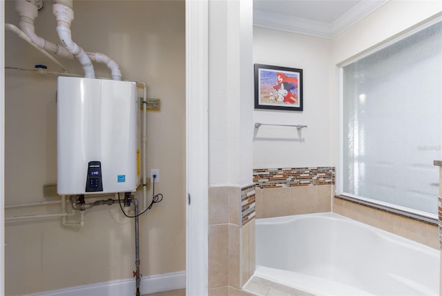 bathroom with tiled bath, crown molding, and tankless water heater