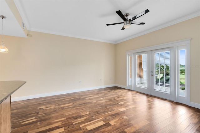 interior space featuring ceiling fan, french doors, crown molding, and dark wood-type flooring