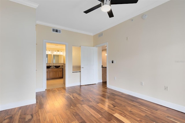 unfurnished room with ceiling fan, hardwood / wood-style floors, and ornamental molding