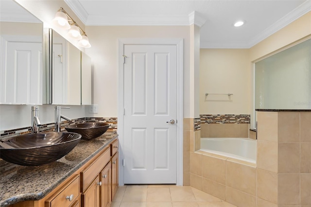 bathroom featuring tiled bath, vanity, tile patterned floors, and ornamental molding