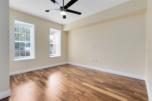 empty room featuring ceiling fan and wood-type flooring