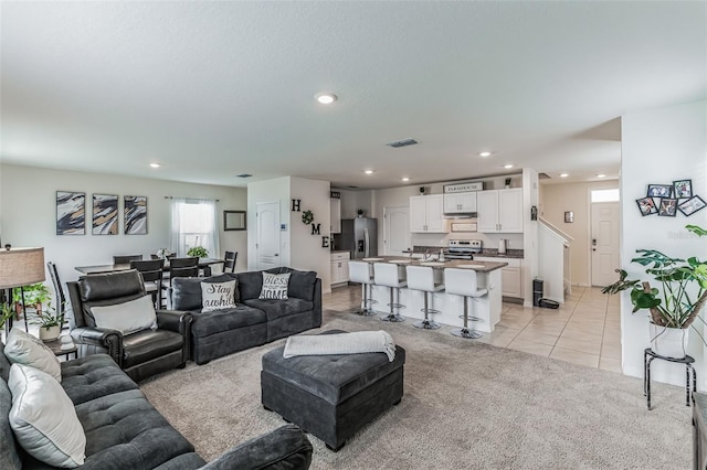 living room featuring light tile patterned floors