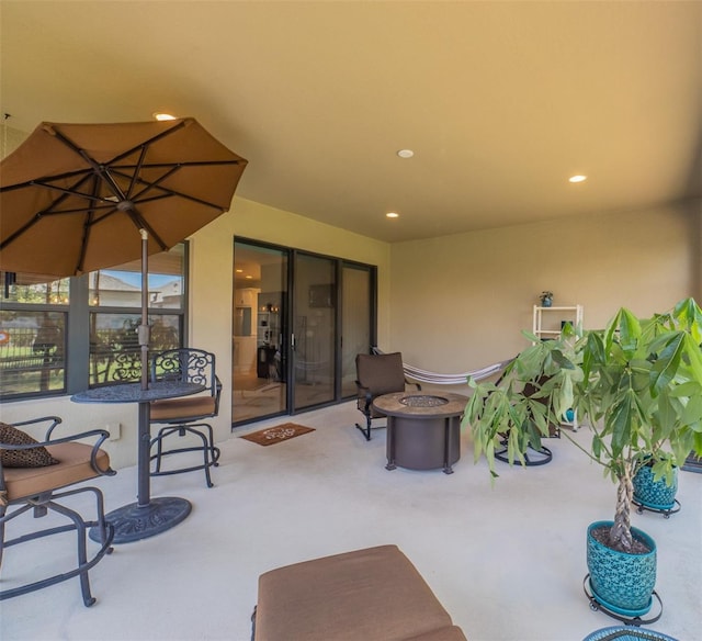 view of patio featuring an outdoor fire pit