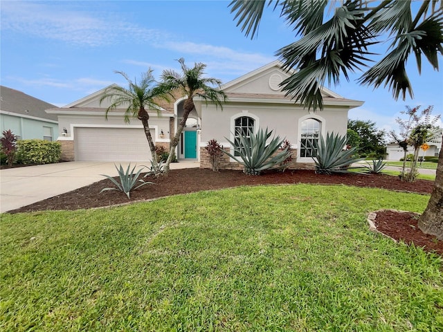 view of front of property featuring a garage and a front lawn