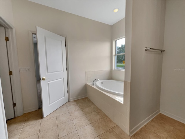 bathroom featuring tiled bath and tile patterned floors