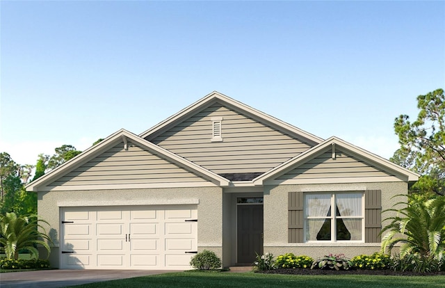 view of front facade with a garage and a front lawn