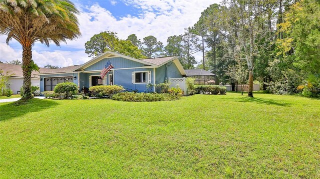 exterior space featuring a front lawn and a garage