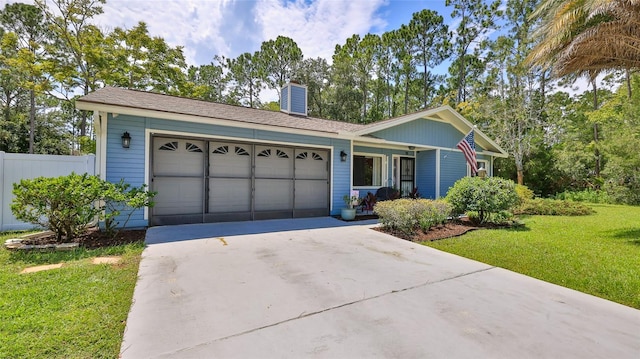 ranch-style home with a garage and a front lawn