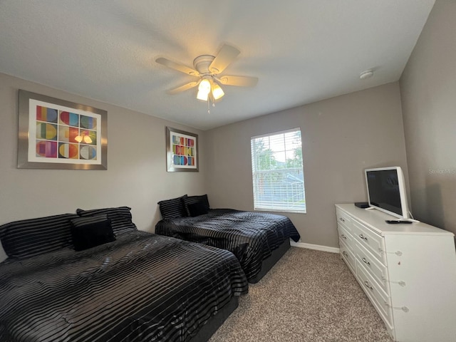 bedroom featuring ceiling fan and light colored carpet