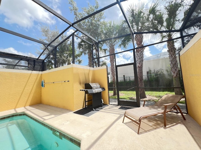 view of patio with a grill and glass enclosure