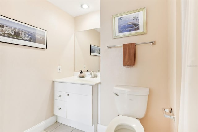 bathroom with tile patterned floors, vanity, and toilet