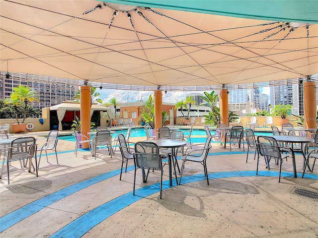 view of patio featuring a community pool