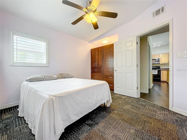 bedroom featuring ceiling fan and vaulted ceiling