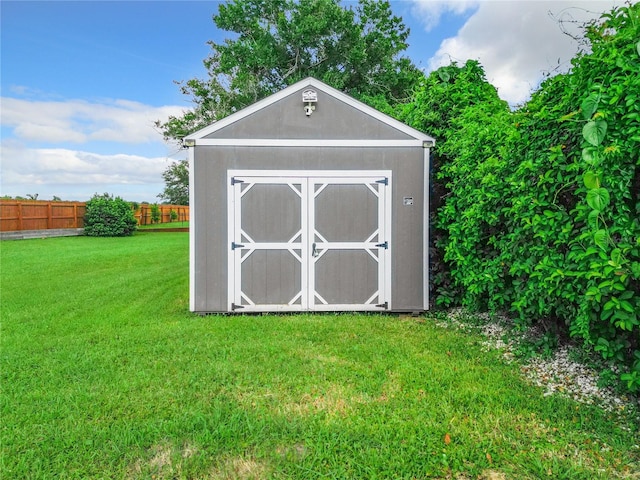 view of outbuilding with a lawn