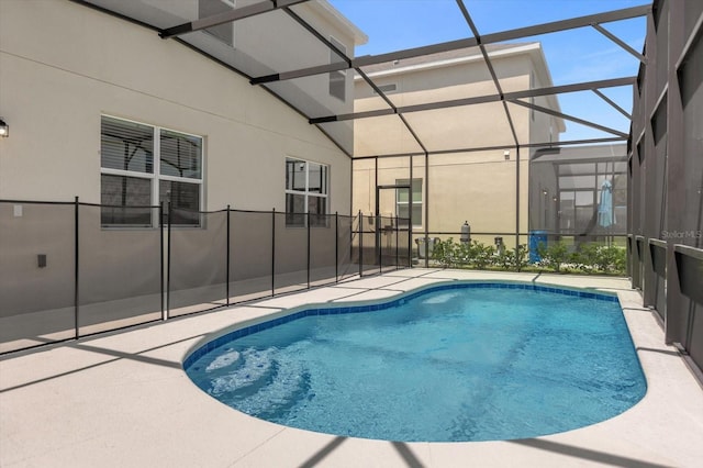 view of pool featuring a patio area and a lanai