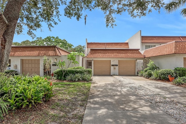 mediterranean / spanish-style home featuring a garage