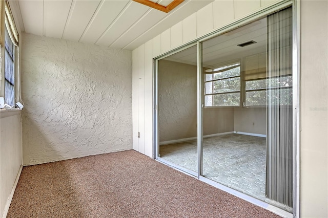 unfurnished bedroom with carpet floors and a closet