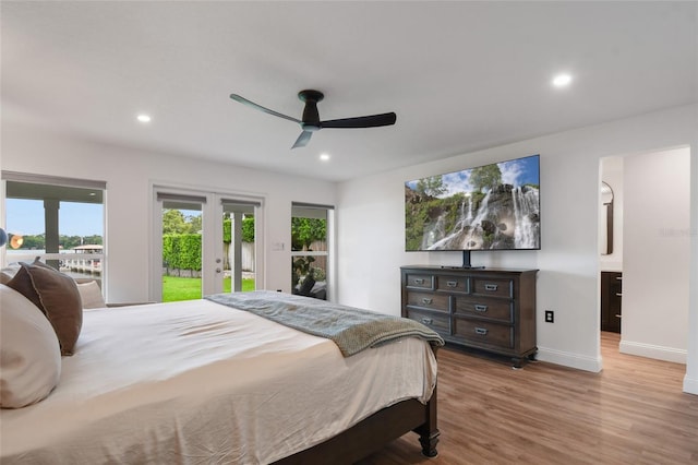 bedroom featuring french doors, ceiling fan, access to exterior, and light wood-type flooring