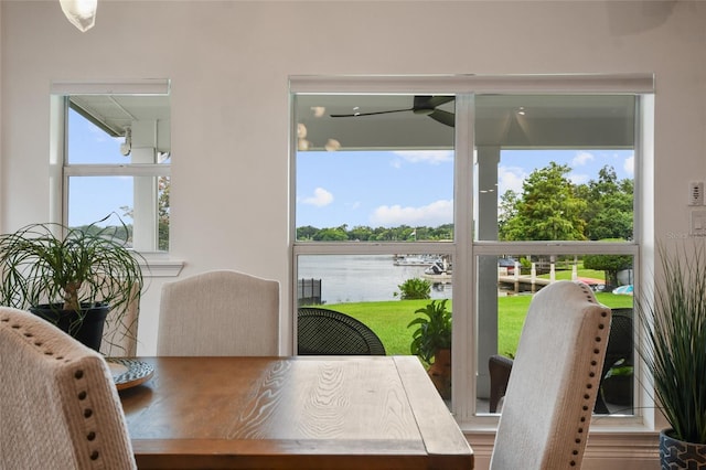 dining area featuring a water view