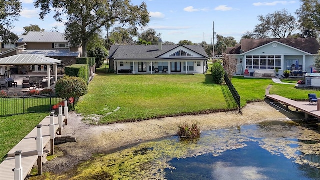 back of property with a water view