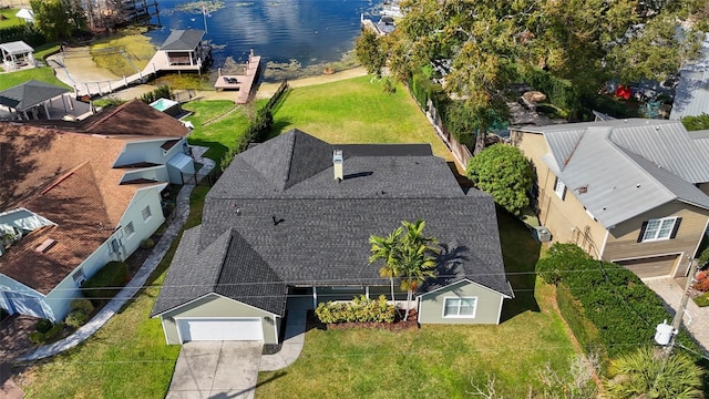 birds eye view of property with a water view