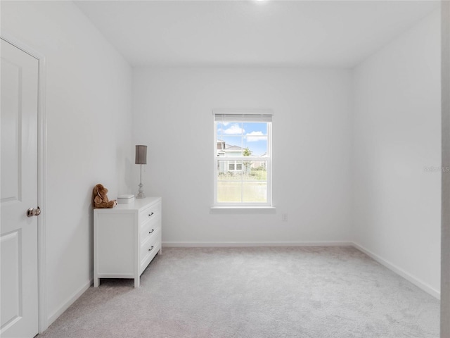 unfurnished bedroom featuring light colored carpet