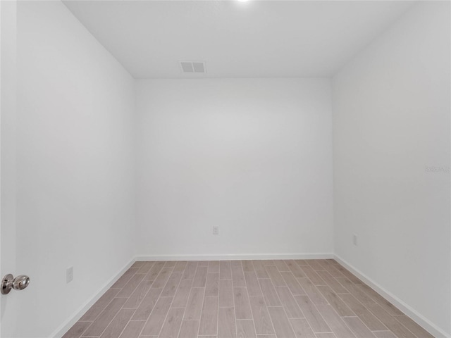 unfurnished room featuring light hardwood / wood-style flooring