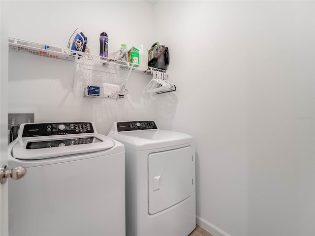 laundry room featuring washing machine and clothes dryer