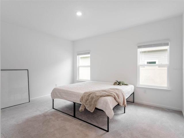 bedroom with light colored carpet