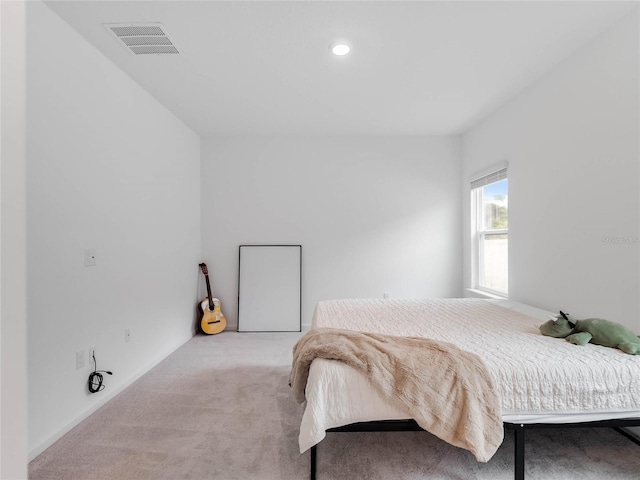 bedroom featuring light carpet