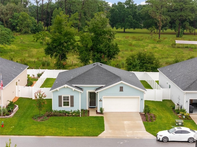 exterior space featuring a garage and a front yard