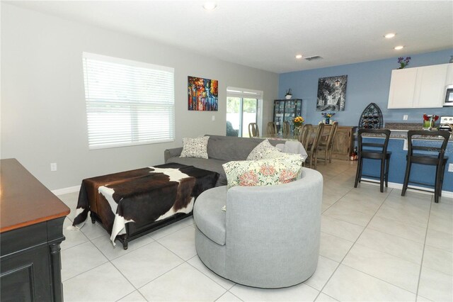 living room featuring light tile patterned flooring